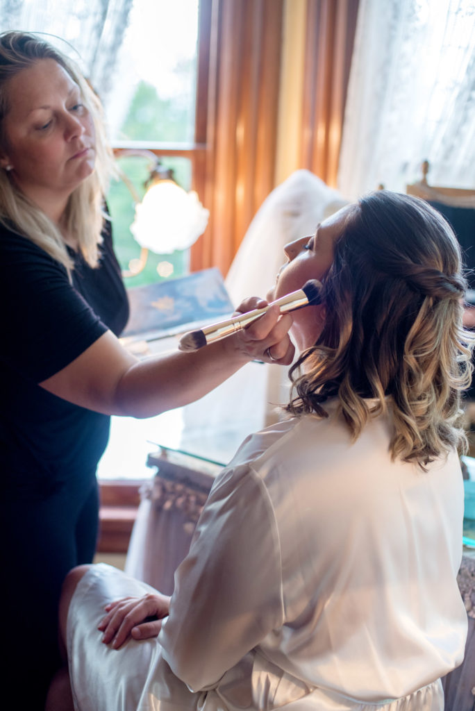 jovana combs of jovana combs beauty at work on a bride
